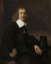 Ein junger Mann sitzt an einem Tisch, vielleicht Govaert Flinck - Rembrandt van Rijn — Ansicht des Kunstwerks
