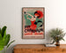 Vintage-Werbeplakat Champagne Damery-Épernay, eingerahmt über einer Holzkommode, zwischen Pflanzen.