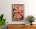 Werbeplakat Vintage Paris-Niort, Sommerneuheiten, gerahmt über einer Holzkommode zwischen Pflanzen.